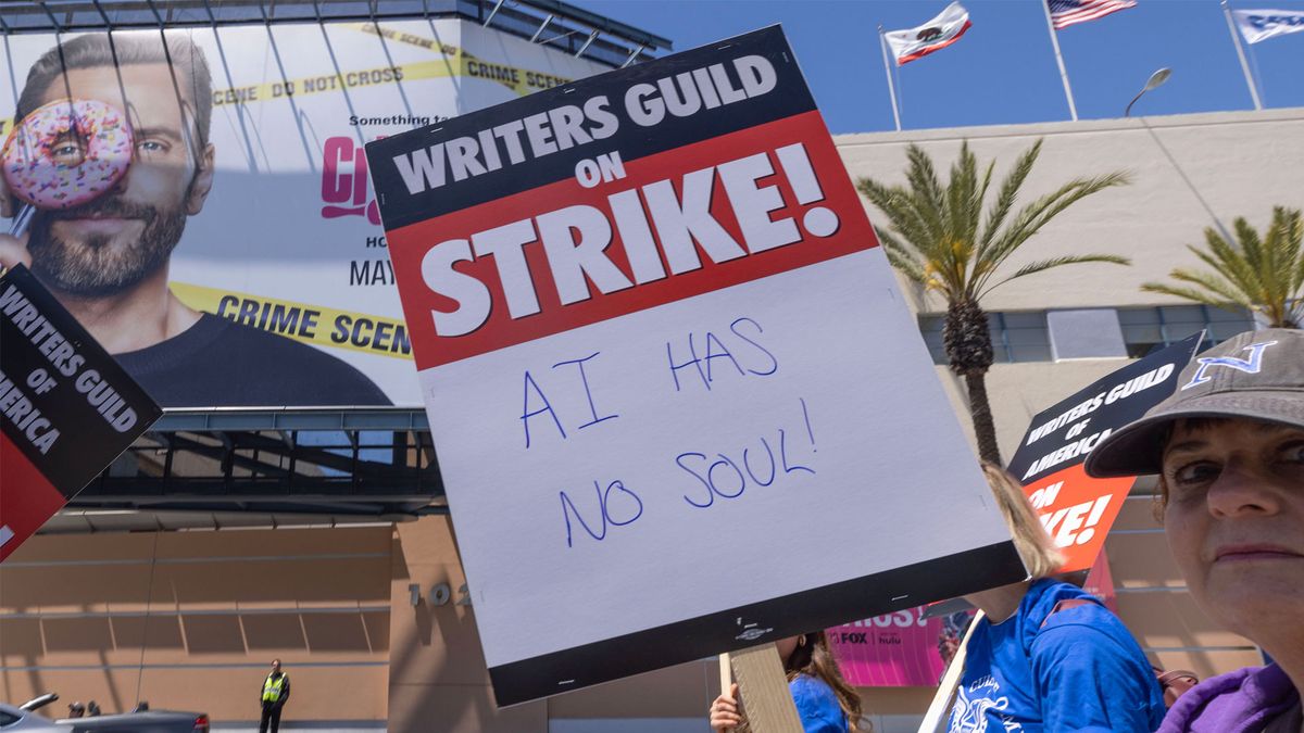 A protestor at the WGA strike of 2023 holds a sign saying &#039;AI has no soul&#039;