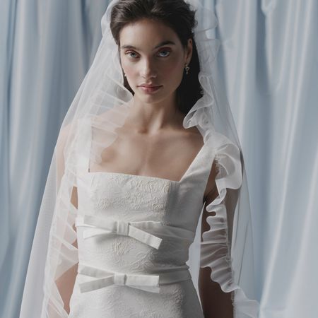 A Markarian bride in front of a blue backdrop