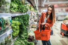 a woman shopping for produce