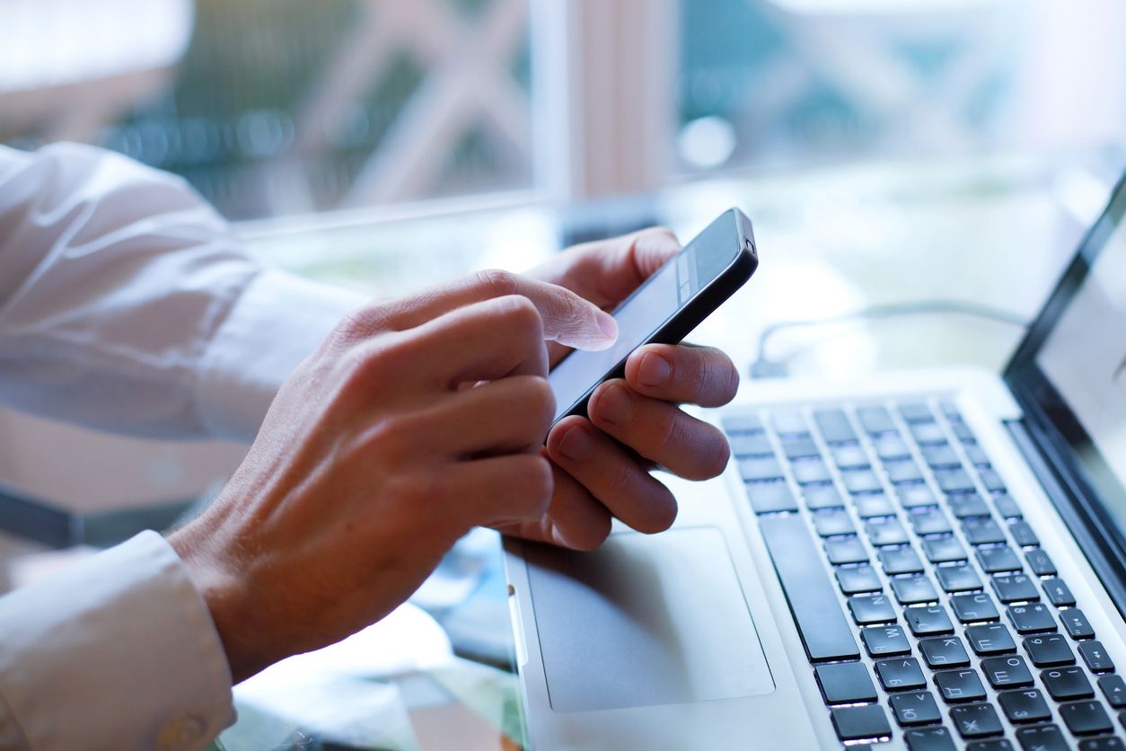 person checking messages on phone.