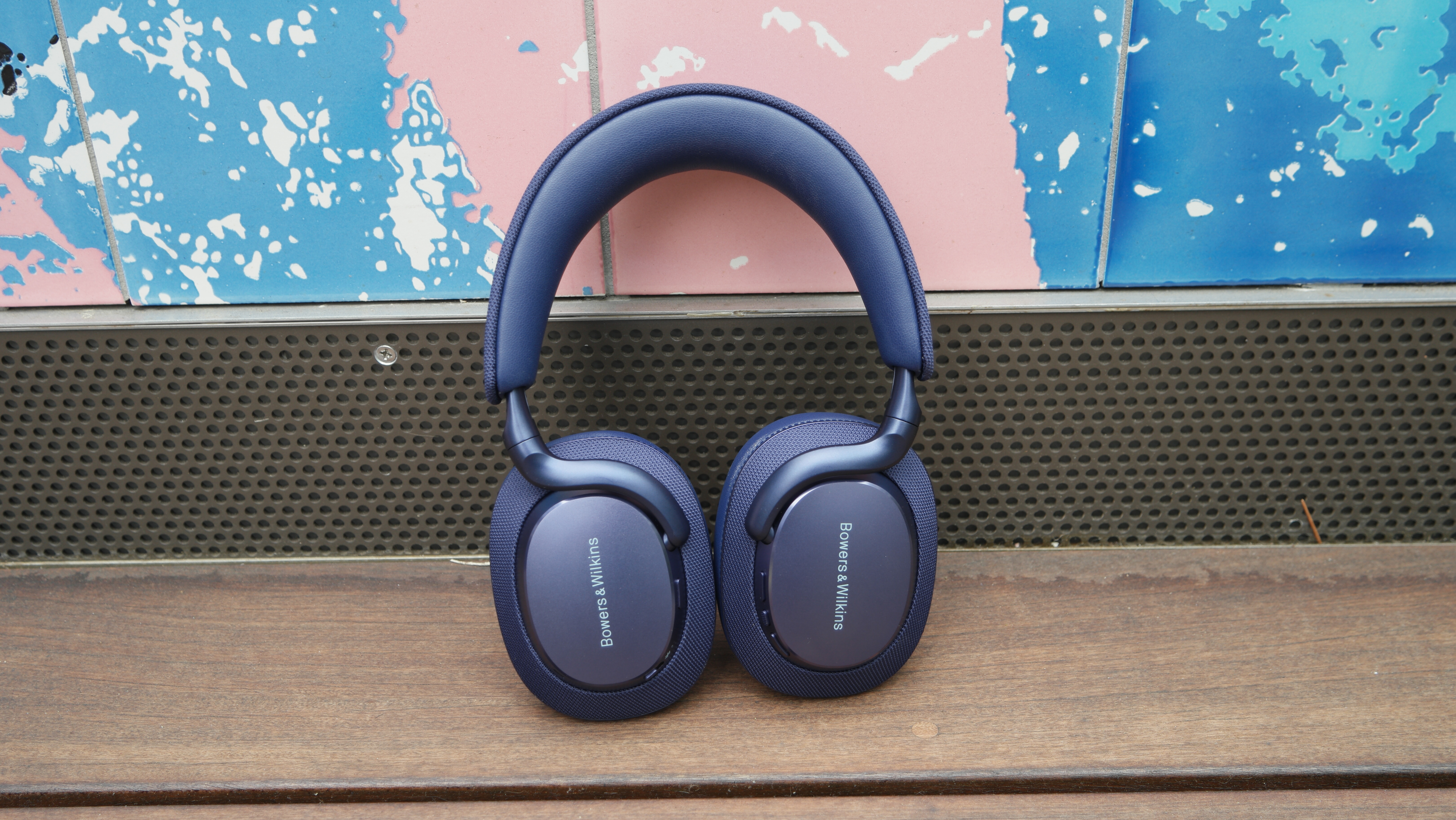 Bowers & Wilkins Px7 S3 propped up on a deck, showing the branding