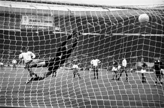Eusebio (white shirt, left) scores a penalty for Portugal past Russia's Lev Yashin in the third-place match at the 1966 World Cup.