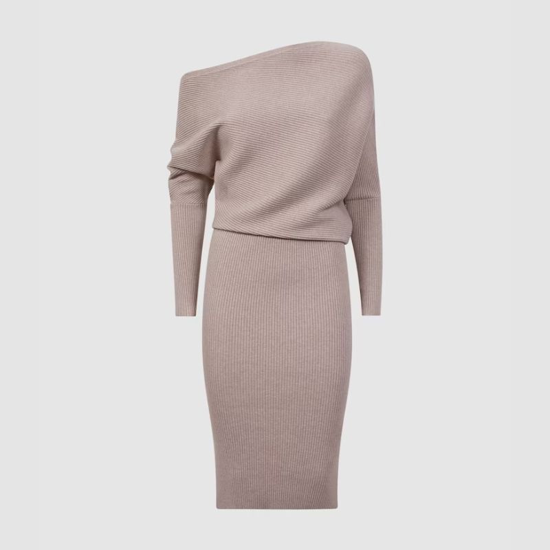 A cutout of a cream ribbed off the shoulder dress by Reiss