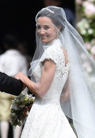 Clothing, Bridal veil, Bridal clothing, Veil, Sleeve, Skin, Forehead, Wedding dress, Photograph, Bride,