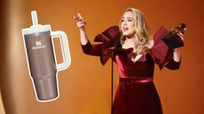 Adele in a burgundy dress pointing to a rose gold Stanley cup