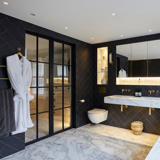 Bathroom with glass doors leading through to a dressing room