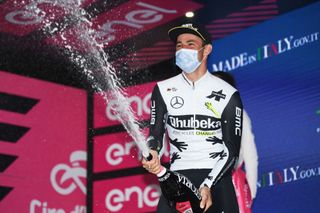 GORIZIA ITALY MAY 23 Victor Campenaerts of Belgium and Team Qhubeka Assos celebrates at podium during the 104th Giro dItalia 2021 Stage 15 a 147km stage from Grado to Gorizia Champagne UCIworldtour girodiitalia Giro on May 23 2021 in Gorizia Italy Photo by Tim de WaeleGetty Images