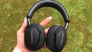 Bowers * Wilkins PX7 S2 headphones on green background