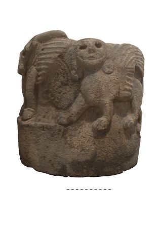 A column base excavated in southeastern Turkey bears a winged bull and carved sphinx.