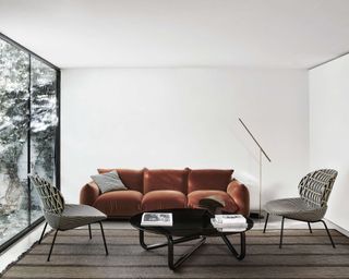 Aram Store modern modular orange sofa in white living room with modern furniture