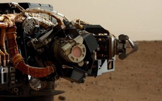 Camera on Curiosity's Arm as Seen by Camera on Mast