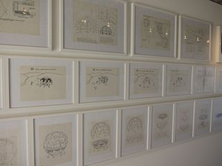 Sketches detailing the renovation process for the 'Fly's Eye Dome' line the walls of one of the three containers in the exhibition space