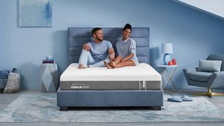A couple on the Tempur-Cloud mattress in a bedroom