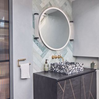 Bathroom with light up mirror over vanity