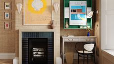 A maximalist home office with a tired surround fireplace, a large shell print above it, a green wall shelf with a small white desk below.