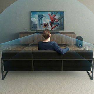 Sony-ZF9 soundbar used with a TV showing Spiderman, with a man sat on a sofa watching it