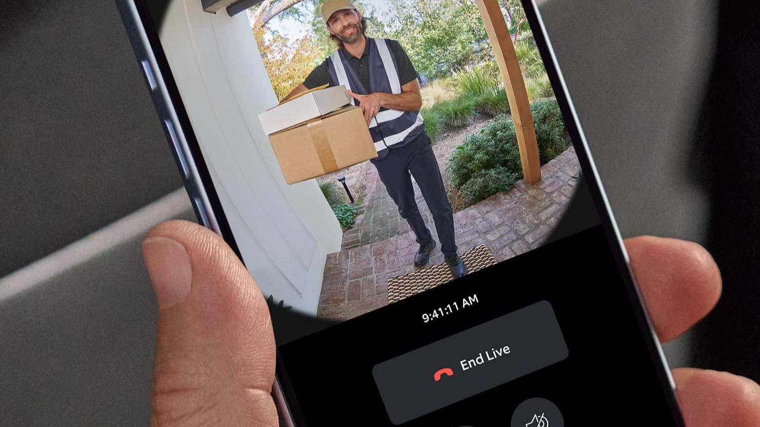 Person watching Ring Battery Doorbell live on smartphone to see delivery man with package