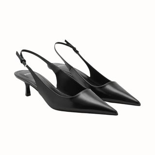 flat lay of black slingback kitten heels