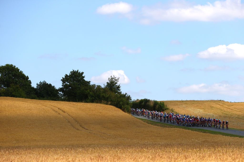 CALAIS FRANCE JULY 05 A general view of the peloton beginning to climb the Cte de Harlettes 204m during the 109th Tour de France 2022 Stage 4 a 1715km stage from Dunkerque to Calais TDF2022 WorldTour on July 05 2022 in Calais France Photo by Michael SteeleGetty Images