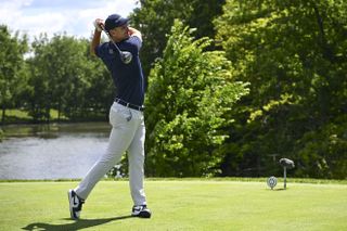 Justin Rose strikes his fairway wood off the tee