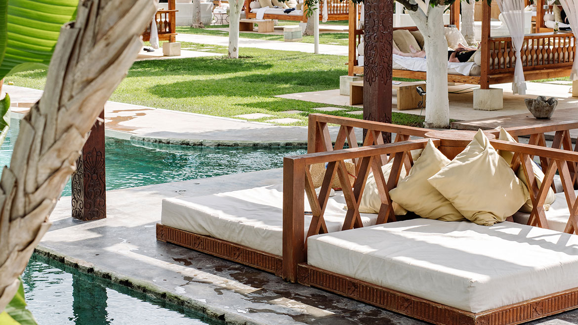 Day beds and pool at Atzaró Agroturismo Hotel