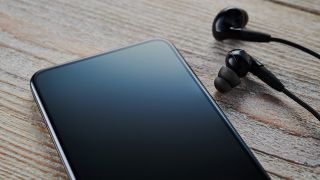 Best in-ear headphones and earbuds: Phone with in-ear headphones