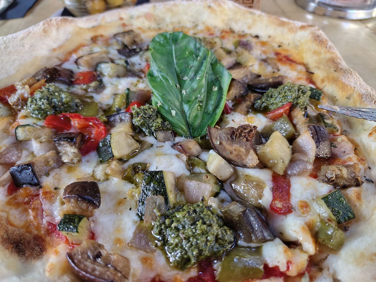 A picture of a vegetable pizza, taken on the Fairphone 6 Plus.