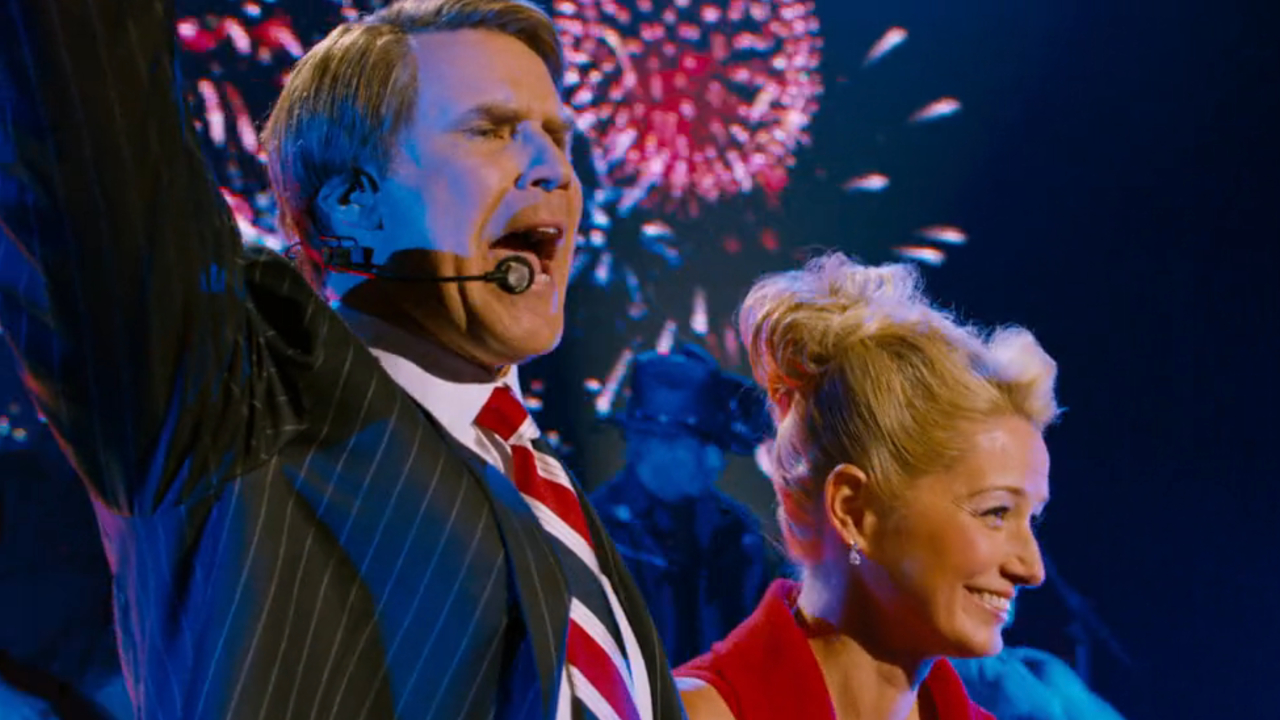 Will Ferrell stands excited with Katherine LaNasa at a campaign rally in The Campaign.