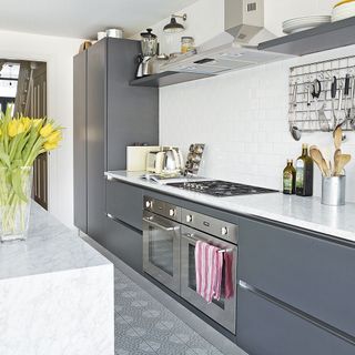 kitchen with grey cabinet and electric oven