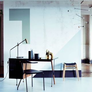 home office with white wall and table and chair