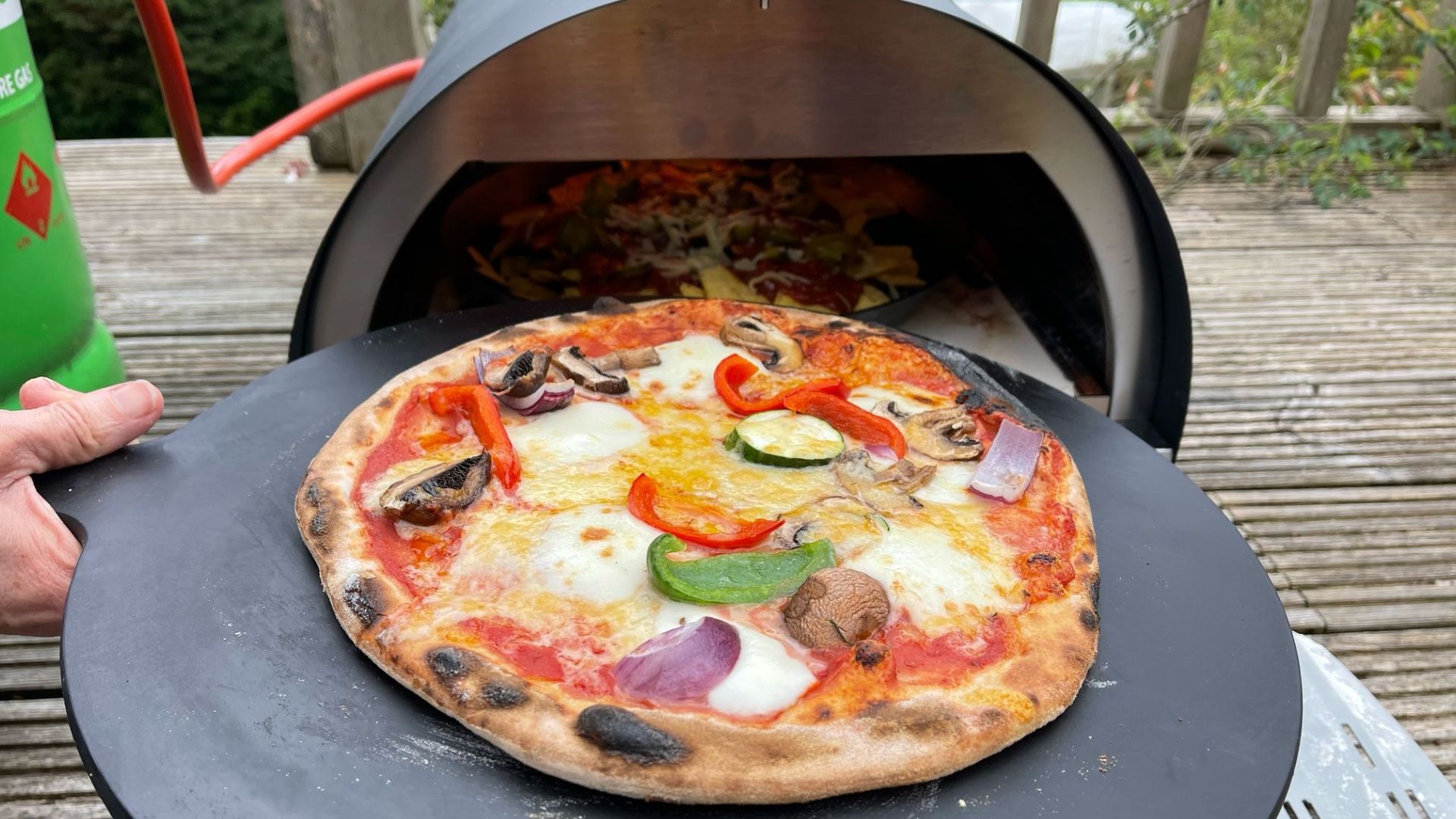 Pizza in front of the Woody Pizza Oven