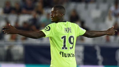 Nicolas Pepe has been pictured wearing an Arsenal shirt ahead of his transfer to the Gunners 