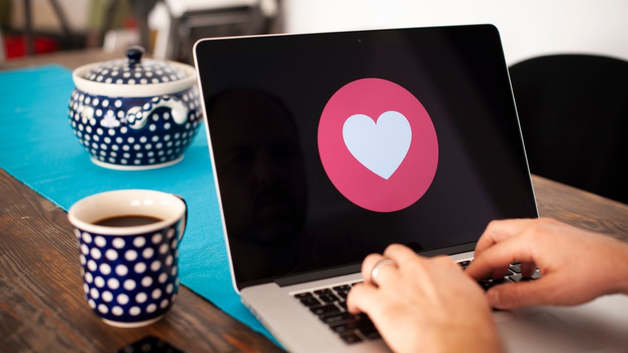 Apple, A laptop screen with a heart emoji is seen in this photo illustration on October 15, 2018 in Warsaw, Poland