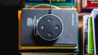Amazon Echo Dot on a stack of books