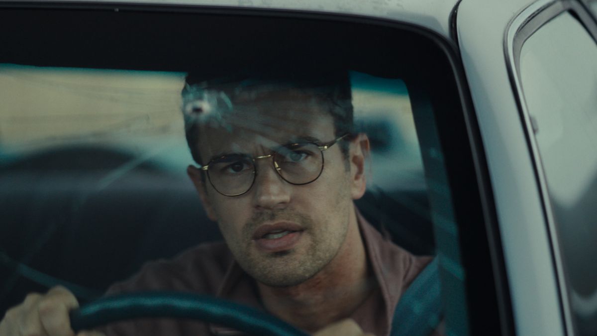 Theo James&#039; Hail sitting in a car with a bullet mark in the windscreen in Neon&#039;s The Monkey, one of February&#039;s new movies