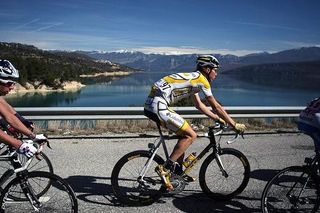 Marcel Sieberg (Team Columbia - Highroad) rides with the snowcapped mountains in the background.