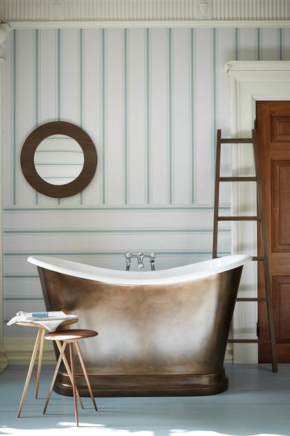 Horzintal and vertical striped wallpaper with white and green, copper bath tub and blue wooden flooring
