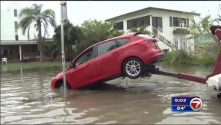 Miami-Dade, Broward residents battle king tide flooding.