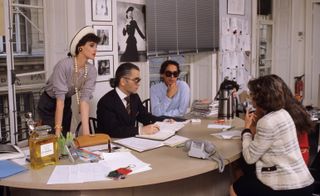 Karl Lagerfeld with his sketches