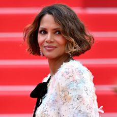 Halle Berry smiles while looking away from the camera at the Cannes Film Festival