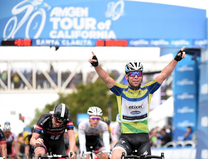 Mark Cavendish celebrates winning his third stage out of fie