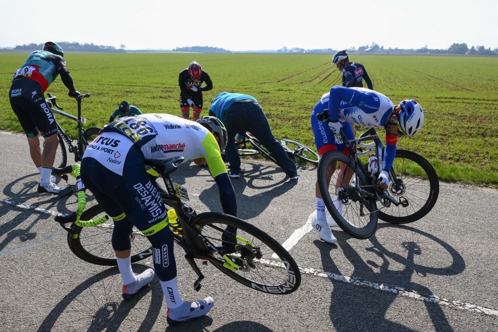 IntermarcheWantyGobert Materiauxs Belgian rider Loc Vliegen C BORAhansgrohes Dutch rider Danny van Poppel L and GroupamaFDJs French rider Olivier Le Gac R react after a crash during the 2nd stage of the 80th edition of the Paris Nice cycling race 1595 km between Auffargis and Orleans on March 7 2022 Photo by FRANCK FIFE AFP Photo by FRANCK FIFEAFP via Getty Images