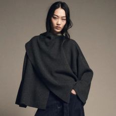 Woman wears scarf cape from Zara