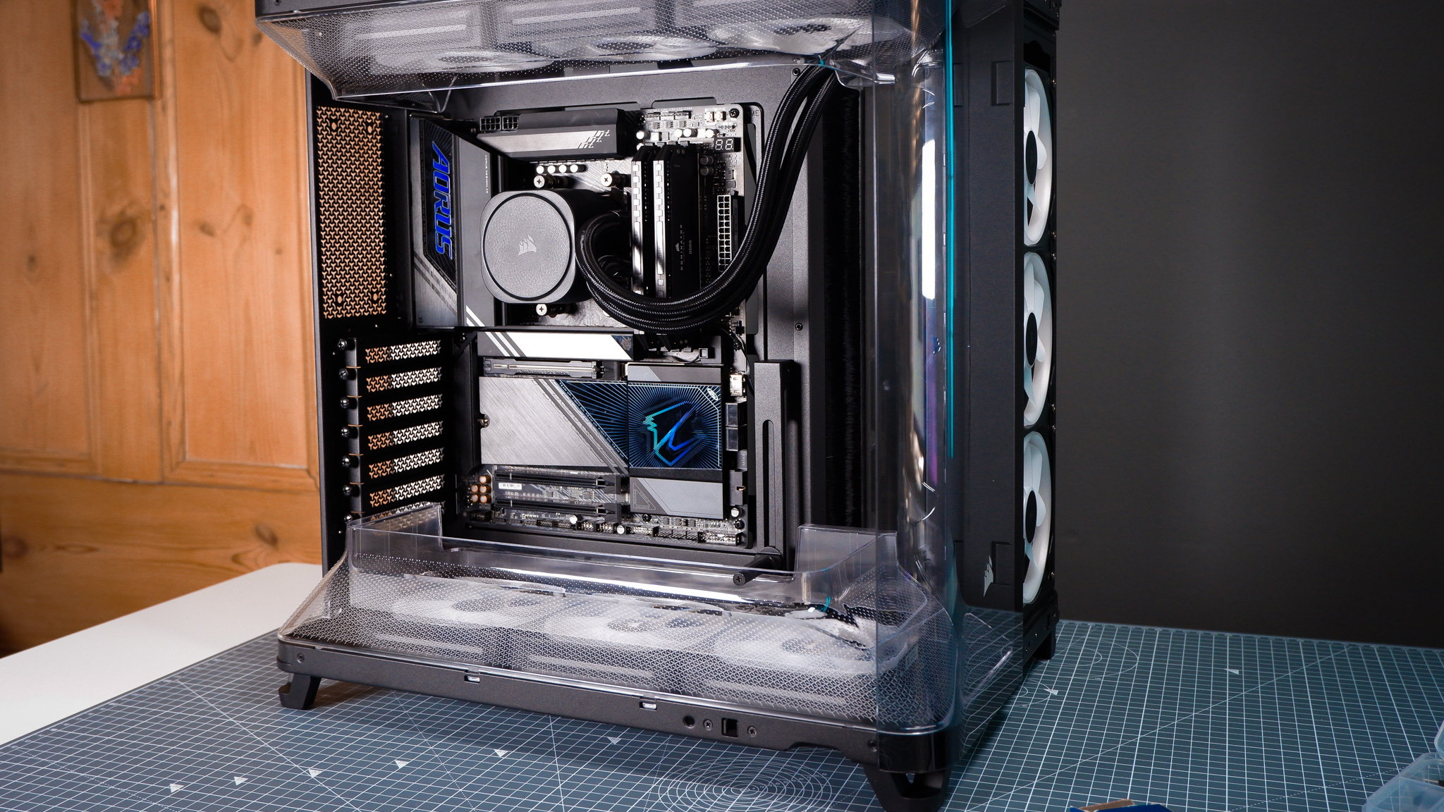 A Corsair Air 5400 PC case on a desk with various parts installed.