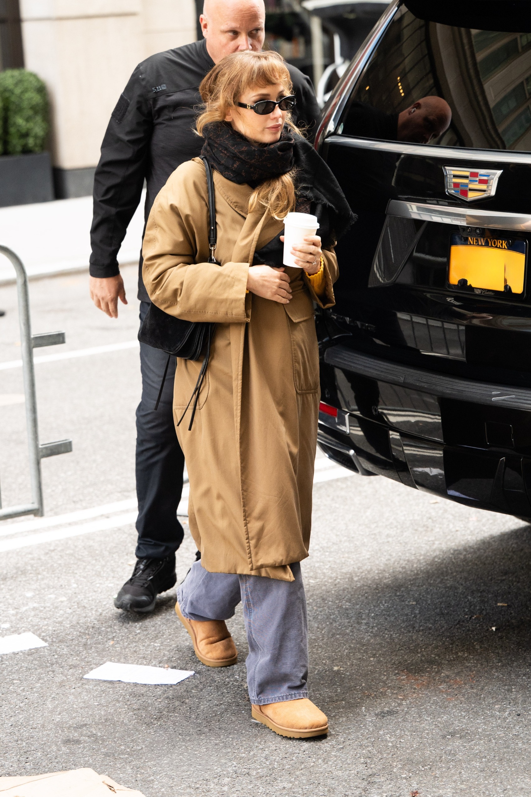 Jennifer Lawrence wore Ugg boots with Carhartt jeans, a Loro Piana wrap coat, and Ugg boots