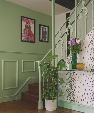 green hallway with green banister