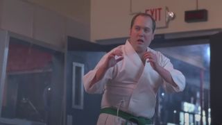 Lutz (John Lutz) prepares to demonstrate his karate skills