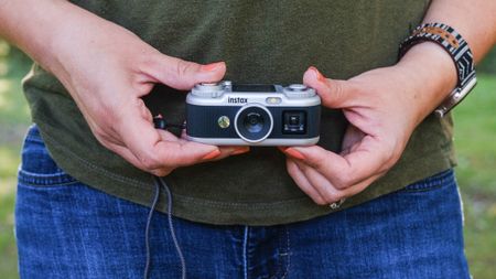 Instax Pal 2 being held by a woman