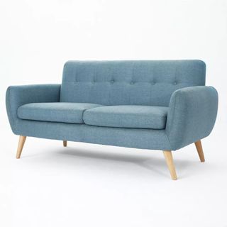 Light blue two-seat sofa on white background