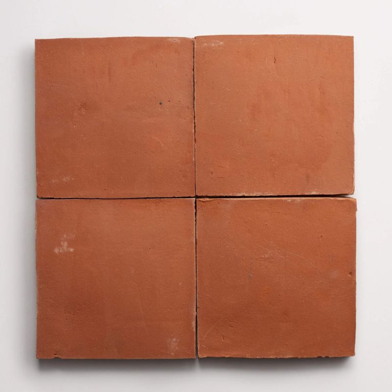 four square terracotta tiles